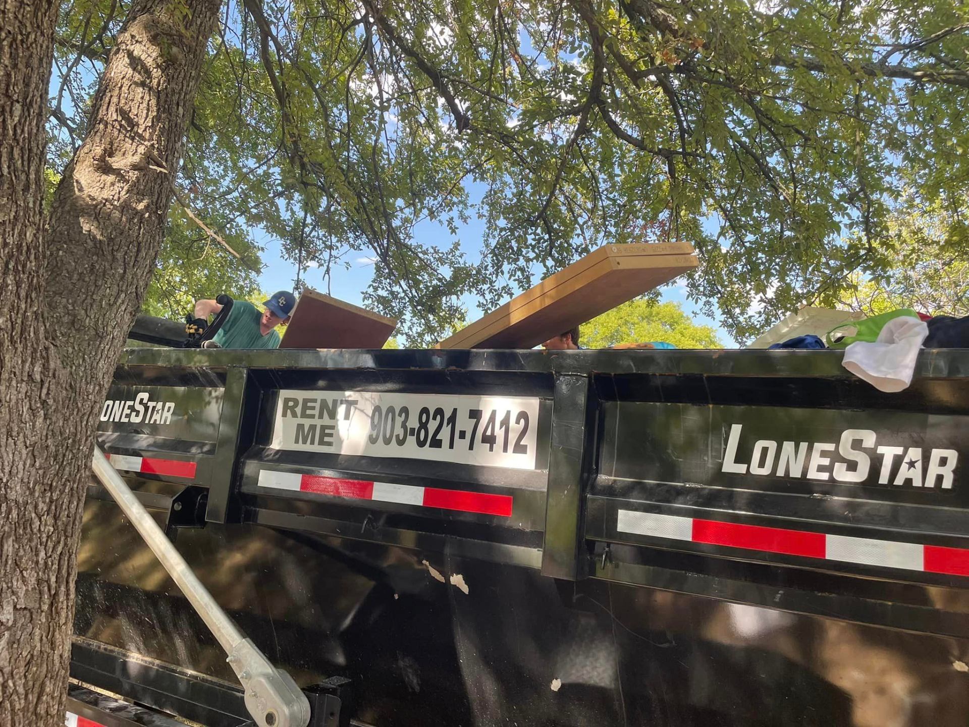 Nash Enterprises Lone Star roll-off dumpster on a job site